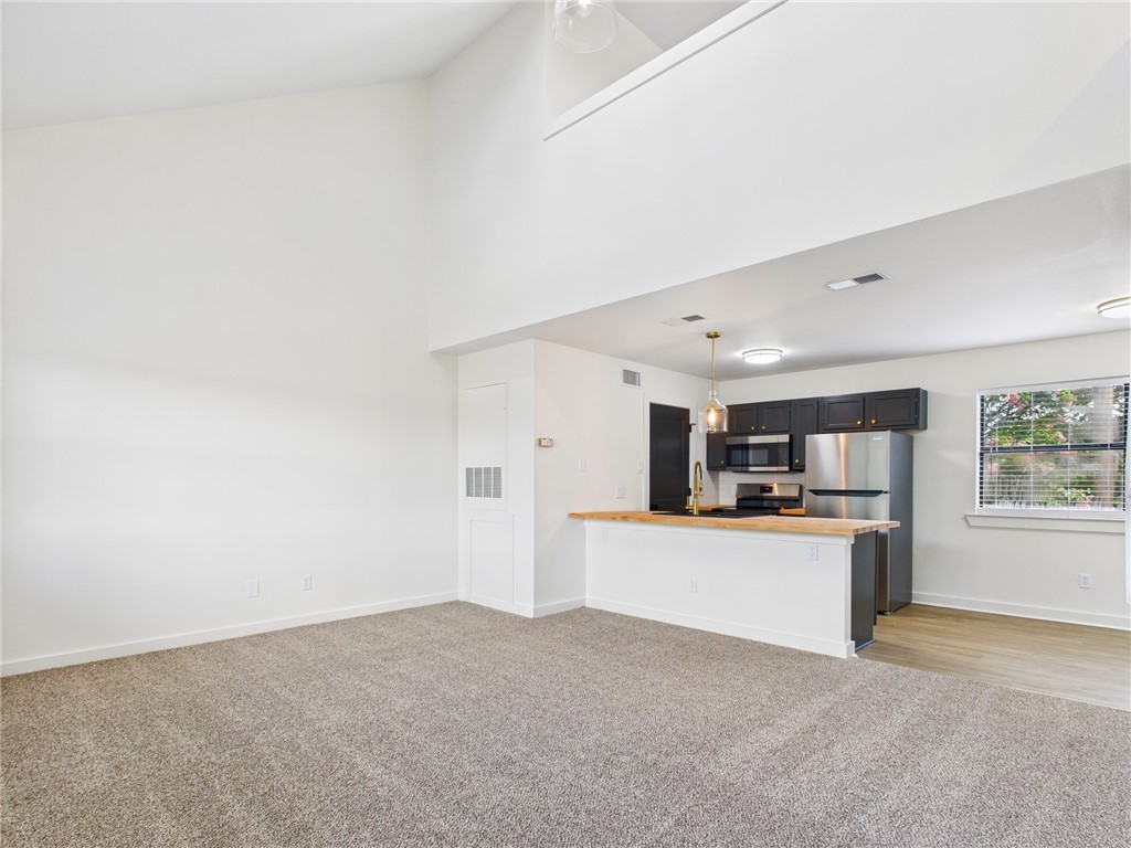 309 Mobile Avenue, Unit 5 Bryan, TX 77801 - Photo 3 of 17 a view of a kitchen with a sink