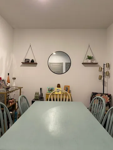 a bedroom with bed and a chair