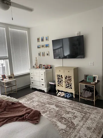a living room with furniture and a flat screen tv
