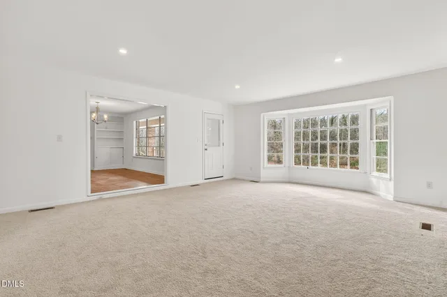 a kitchen with granite countertop a sink stove and refrigerator
