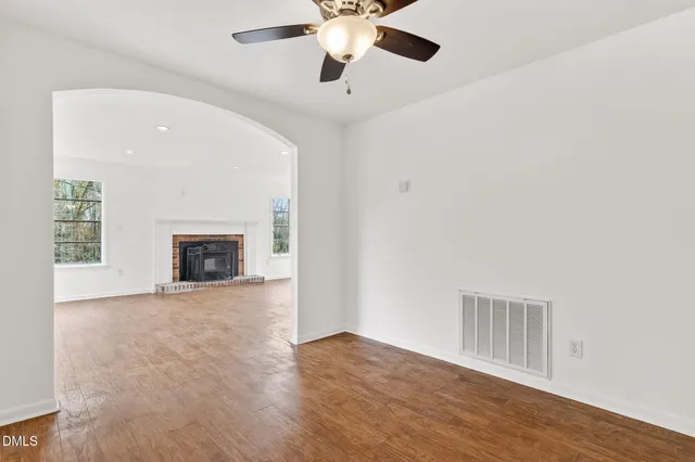 a view of room with window and ceiling fan