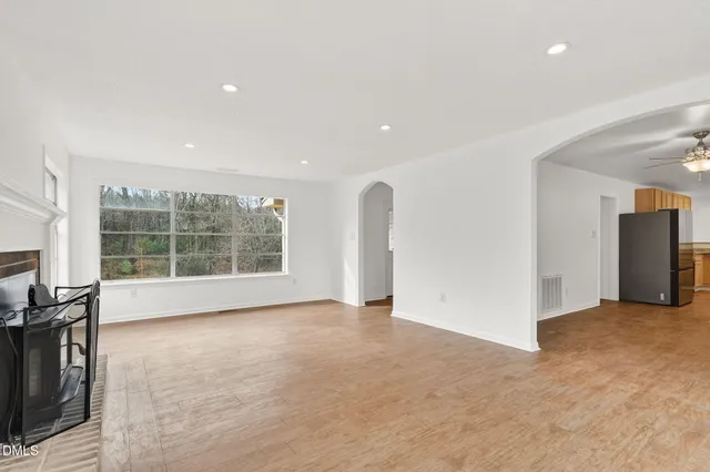 a view of an empty room with a window