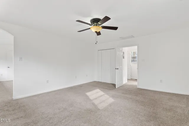 a view of an empty room with a balcony
