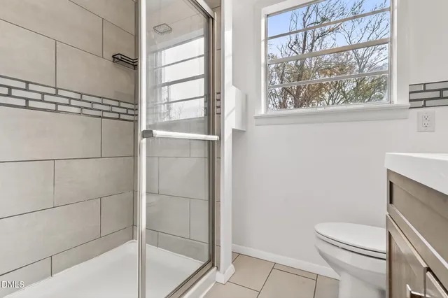 a front view of a house with a garage