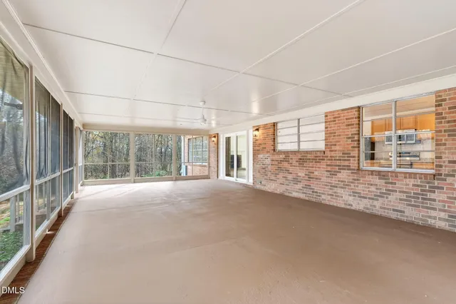 a view of a swimming pool with a yard