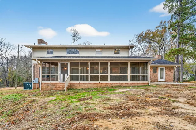 an aerial view of a house with a swimming pool