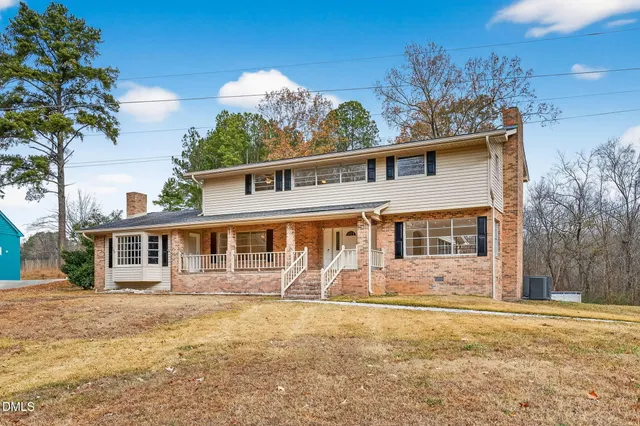 a view of an empty room with a fireplace