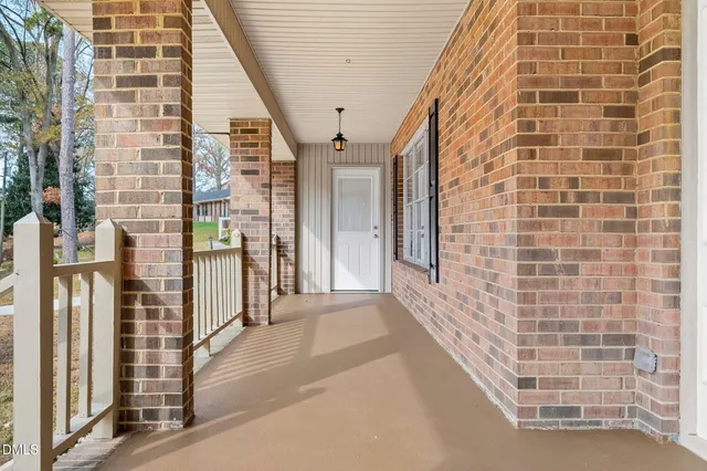 an empty room with a fireplace