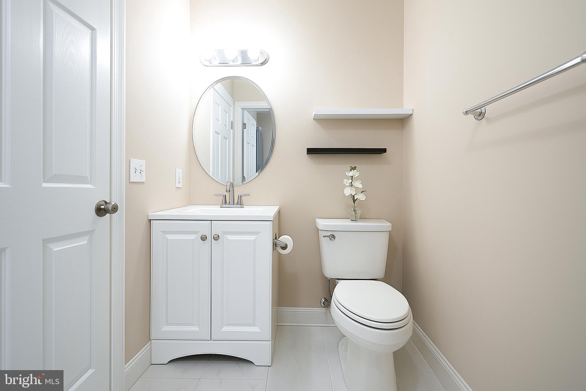 110 Hopewell Road Marlton, NJ 08053 - Photo 54 of 54 a bathroom with a toilet a sink and a mirror