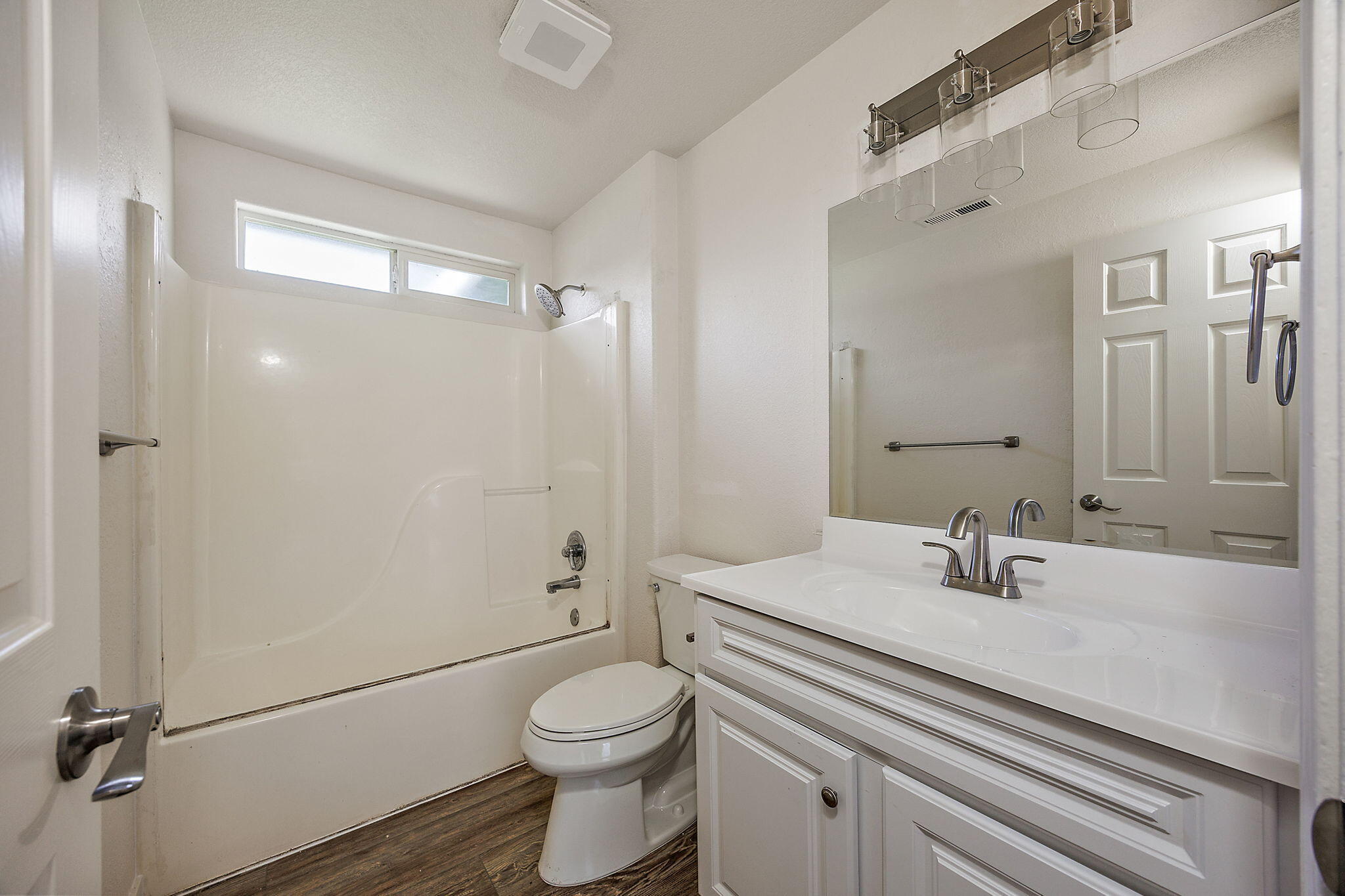 7919 Lower River Road Grants Pass, OR 97526 - Photo 22 of 27 Guest Bath with new floors, paint, cabinet, faucet, light fixture, shower head