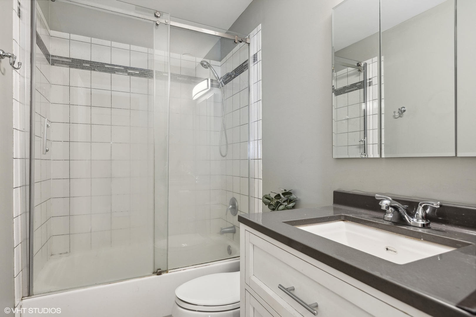 459 Simone Drive Des Plaines, IL 60016 - Photo 15 of 23 a bathroom with a granite countertop sink toilet and shower