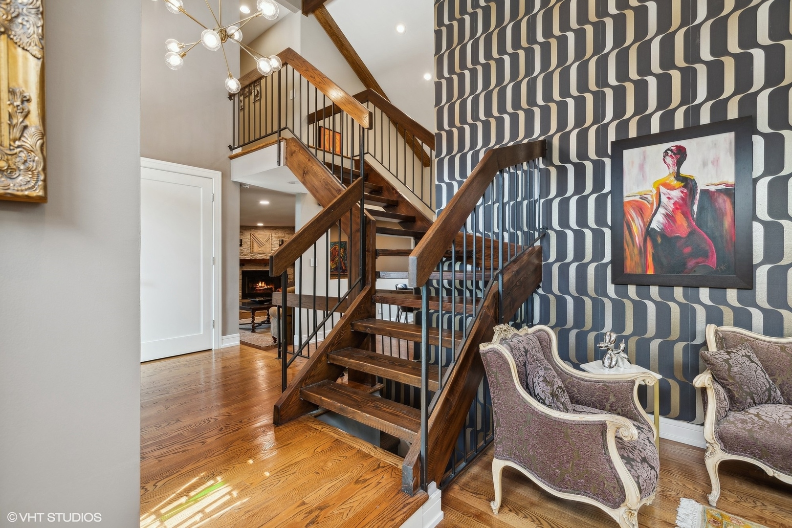 459 Simone Drive Des Plaines, IL 60016 - Photo 4 of 23 a view of staircase with lots of frames on wall and a window