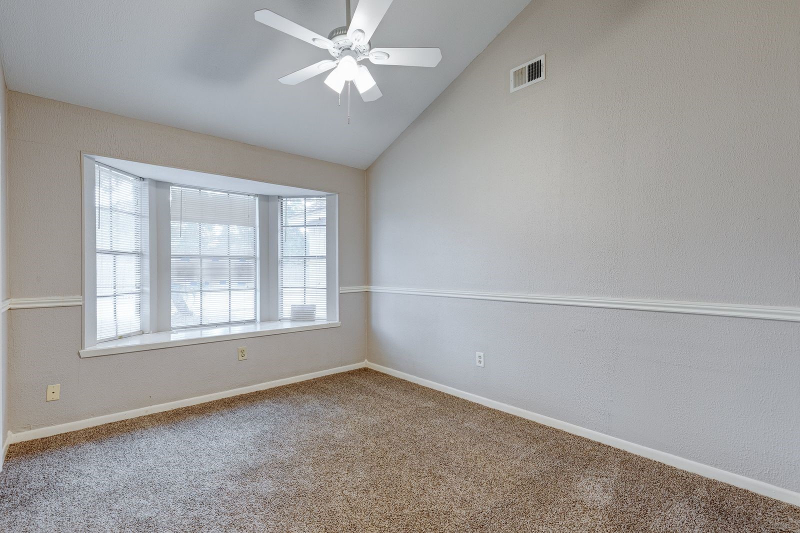 5102 Parsley Avenue Baytown, TX 77521 - Photo 6 of 19 an empty room with a window and ceiling fan