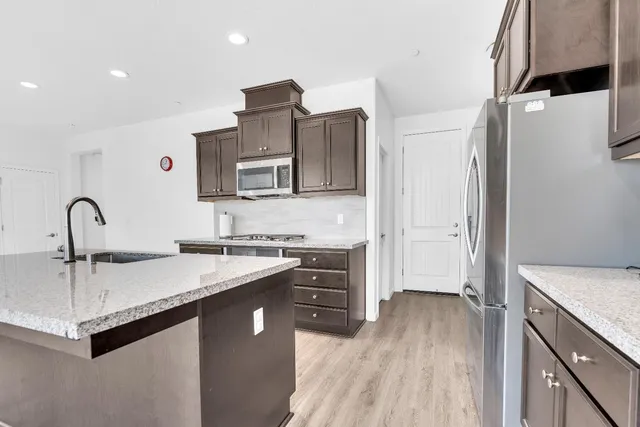 a kitchen with a sink and stove