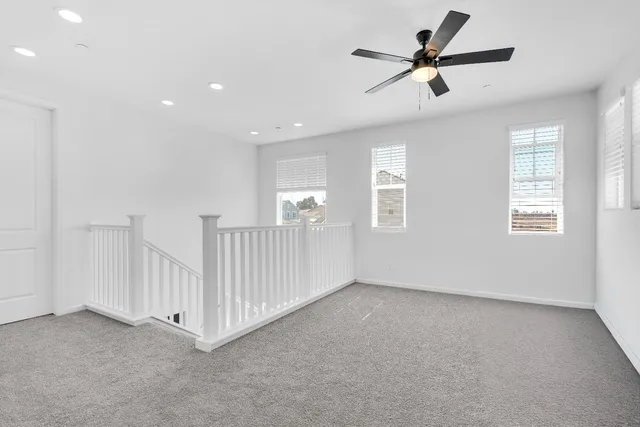 a spacious bathroom with a granite countertop sink and a mirror
