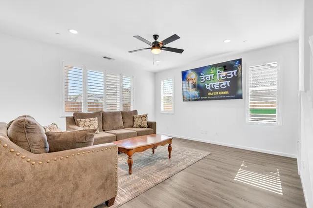 a living room with furniture and a large window