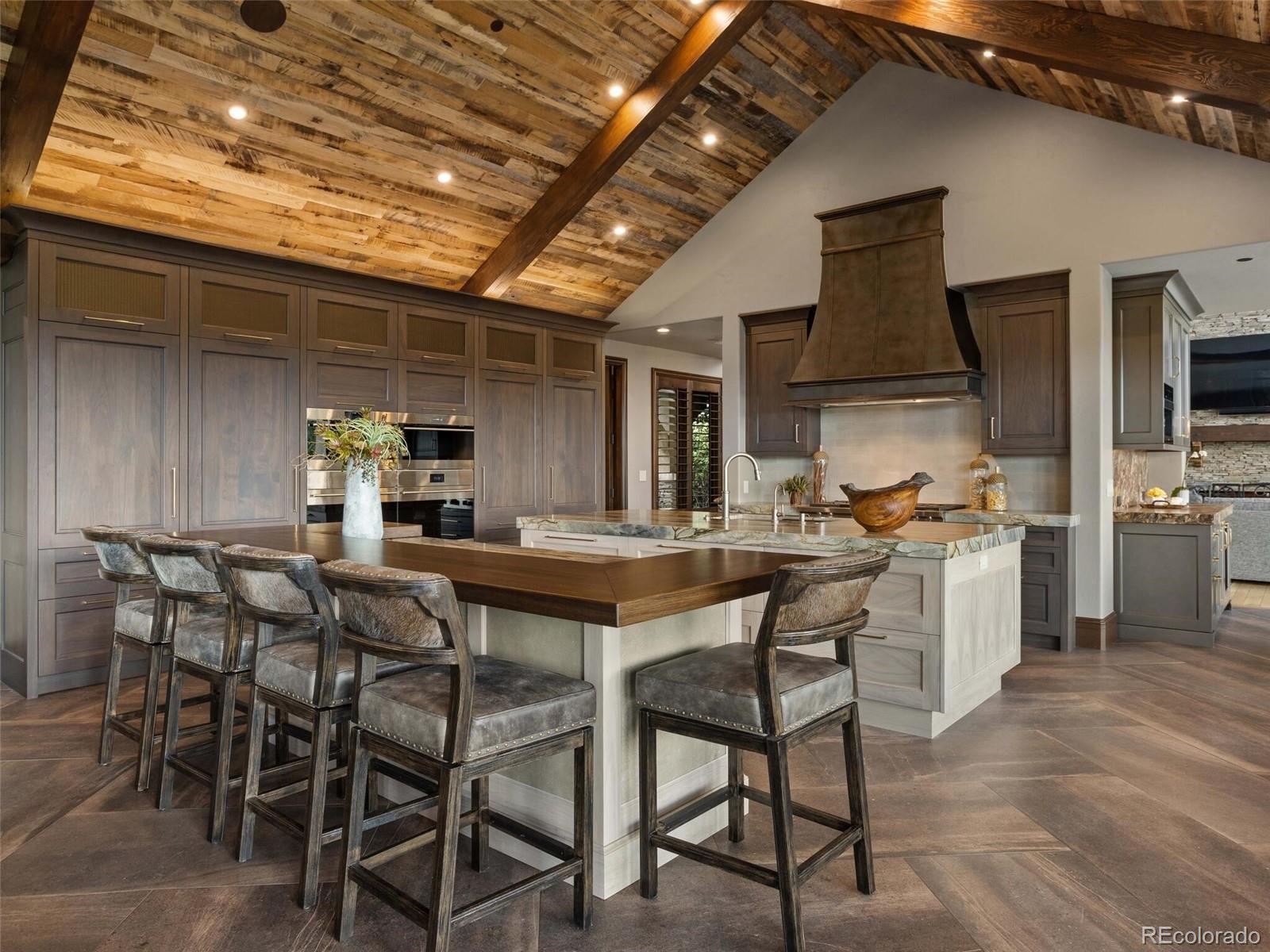 1395 Waverton Ranch Road Castle Rock, CO 80109 - Photo 13 of 40 a view of a kitchen and dining room