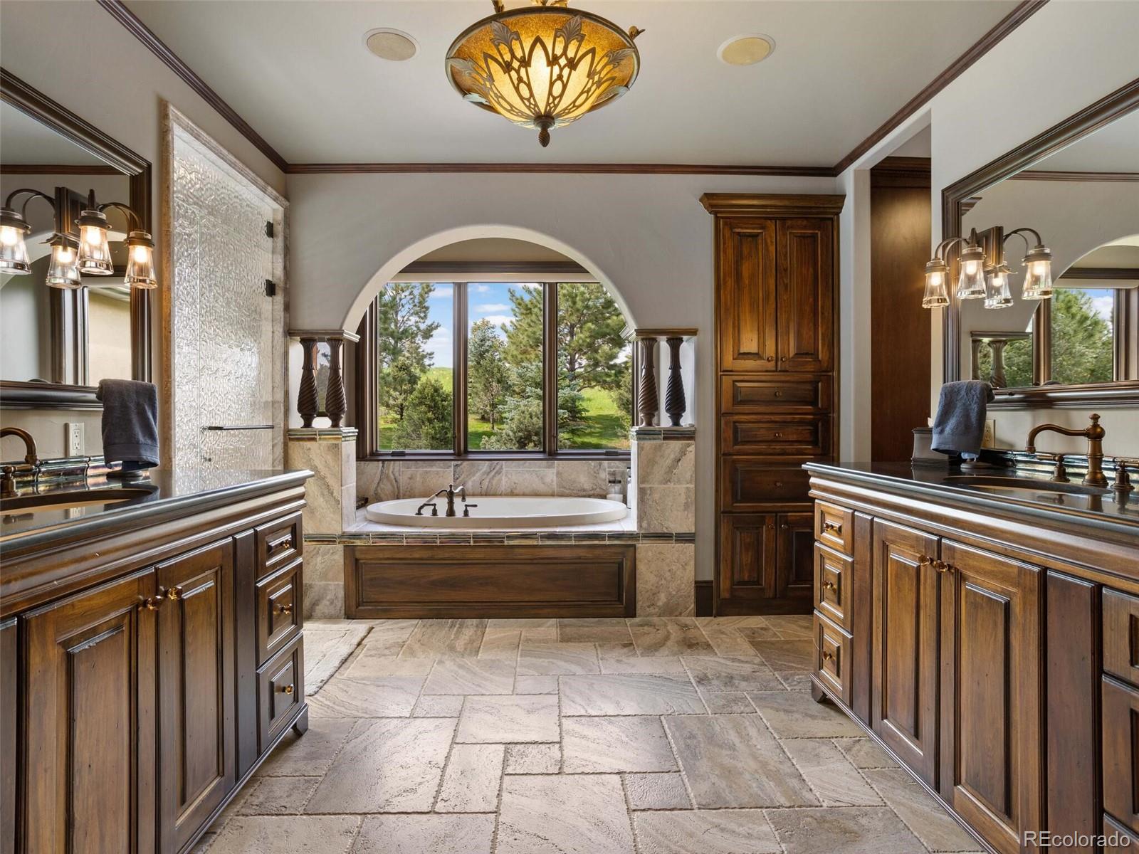 1395 Waverton Ranch Road Castle Rock, CO 80109 - Photo 19 of 40 a large kitchen with a large window and a sink