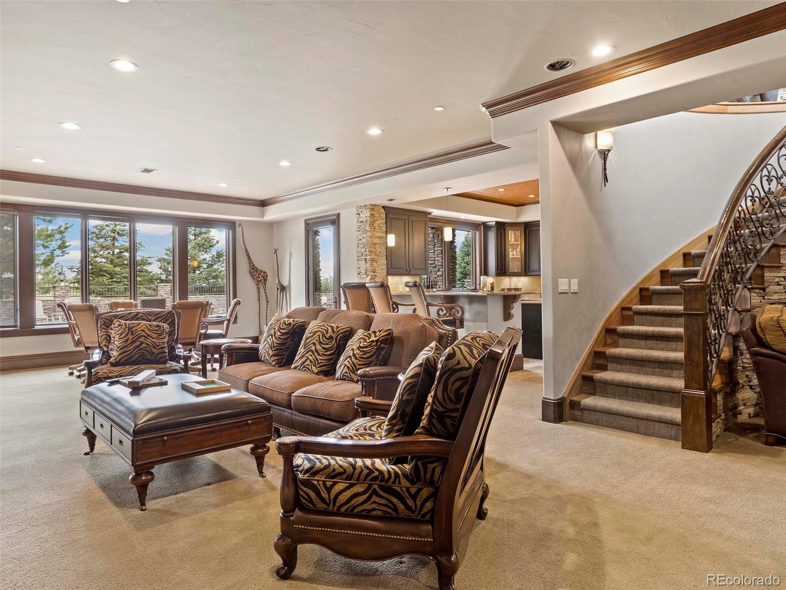 1395 Waverton Ranch Road Castle Rock, CO 80109 - Photo 23 of 40 a living room with furniture and a large window