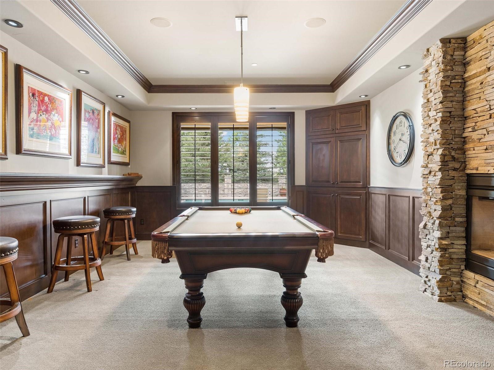 1395 Waverton Ranch Road Castle Rock, CO 80109 - Photo 24 of 40 a room with pool table and windows