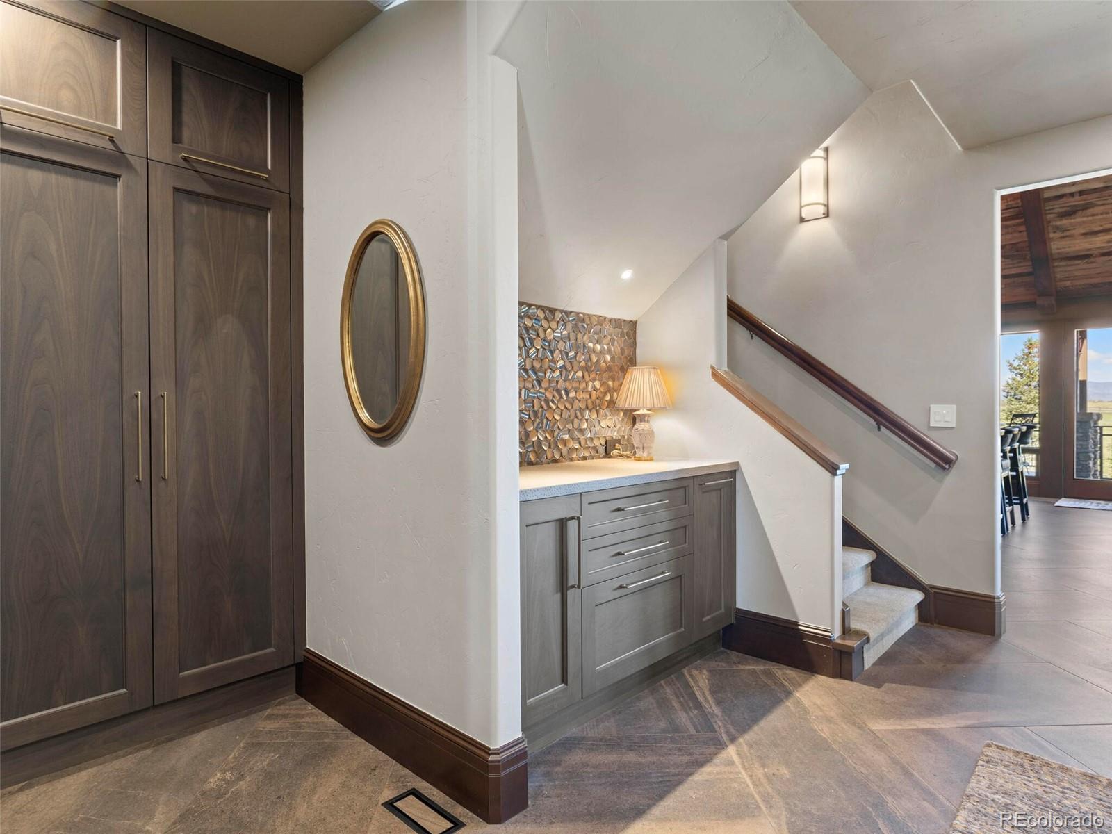 1395 Waverton Ranch Road Castle Rock, CO 80109 - Photo 28 of 40 a view of a hallway with entryway