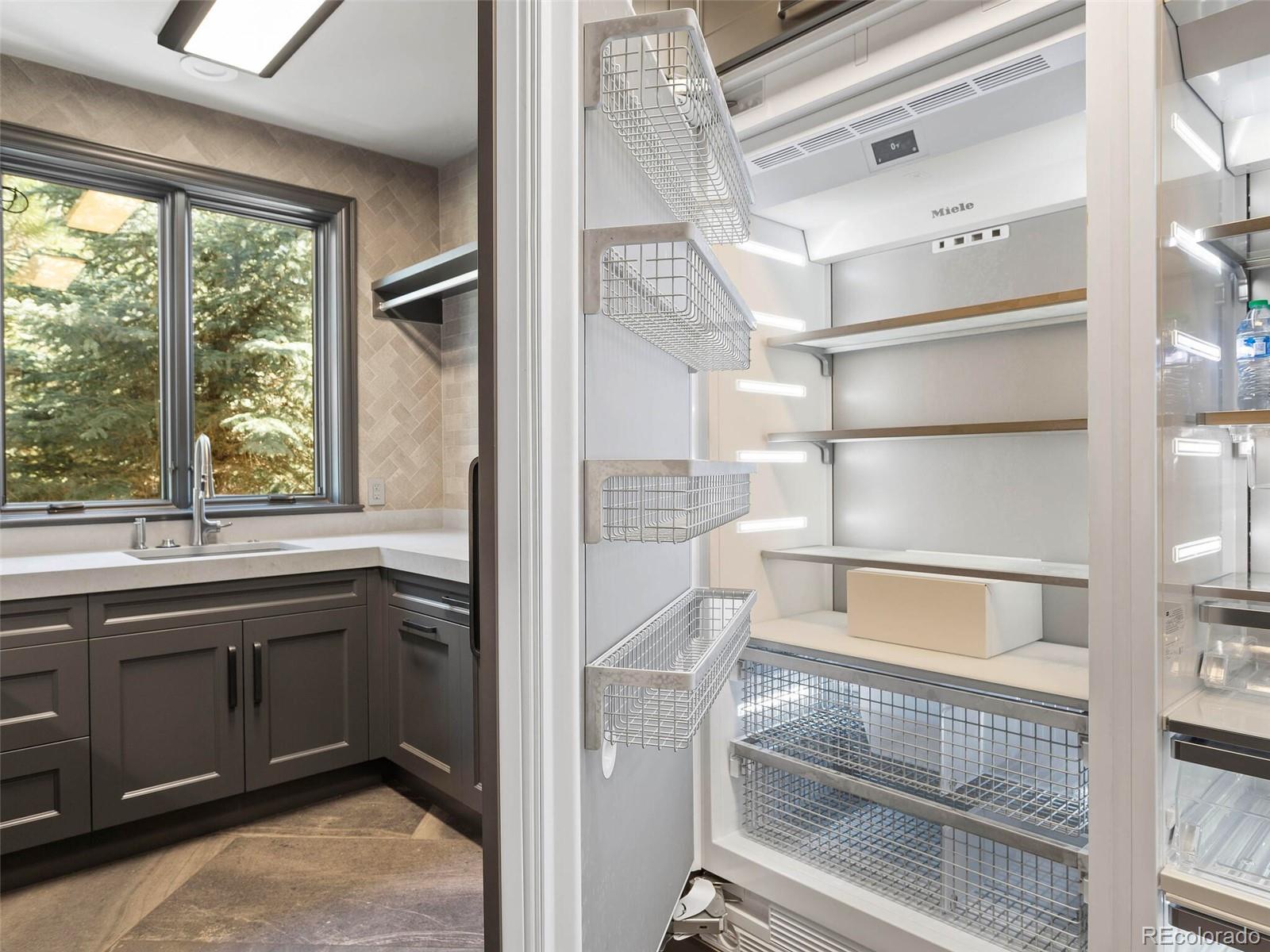1395 Waverton Ranch Road Castle Rock, CO 80109 - Photo 30 of 40 a view of walk in closet with window