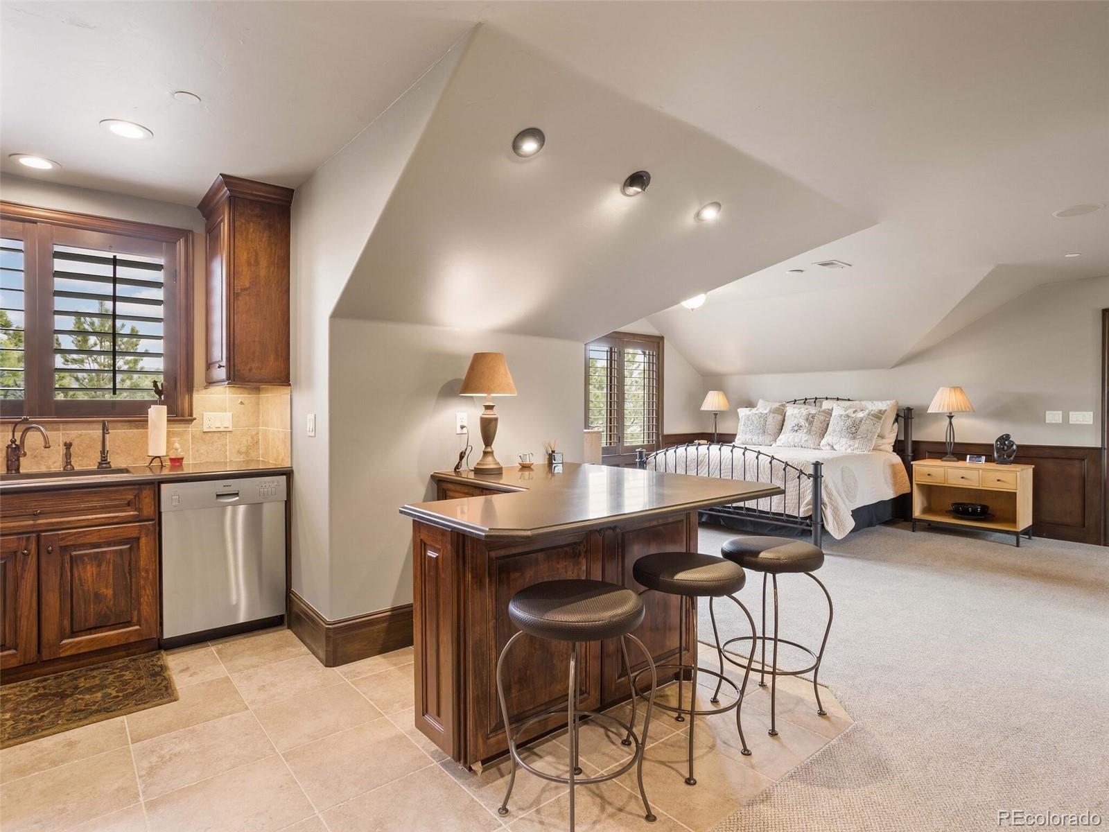 1395 Waverton Ranch Road Castle Rock, CO 80109 - Photo 31 of 40 a living room with furniture a window and kitchen view