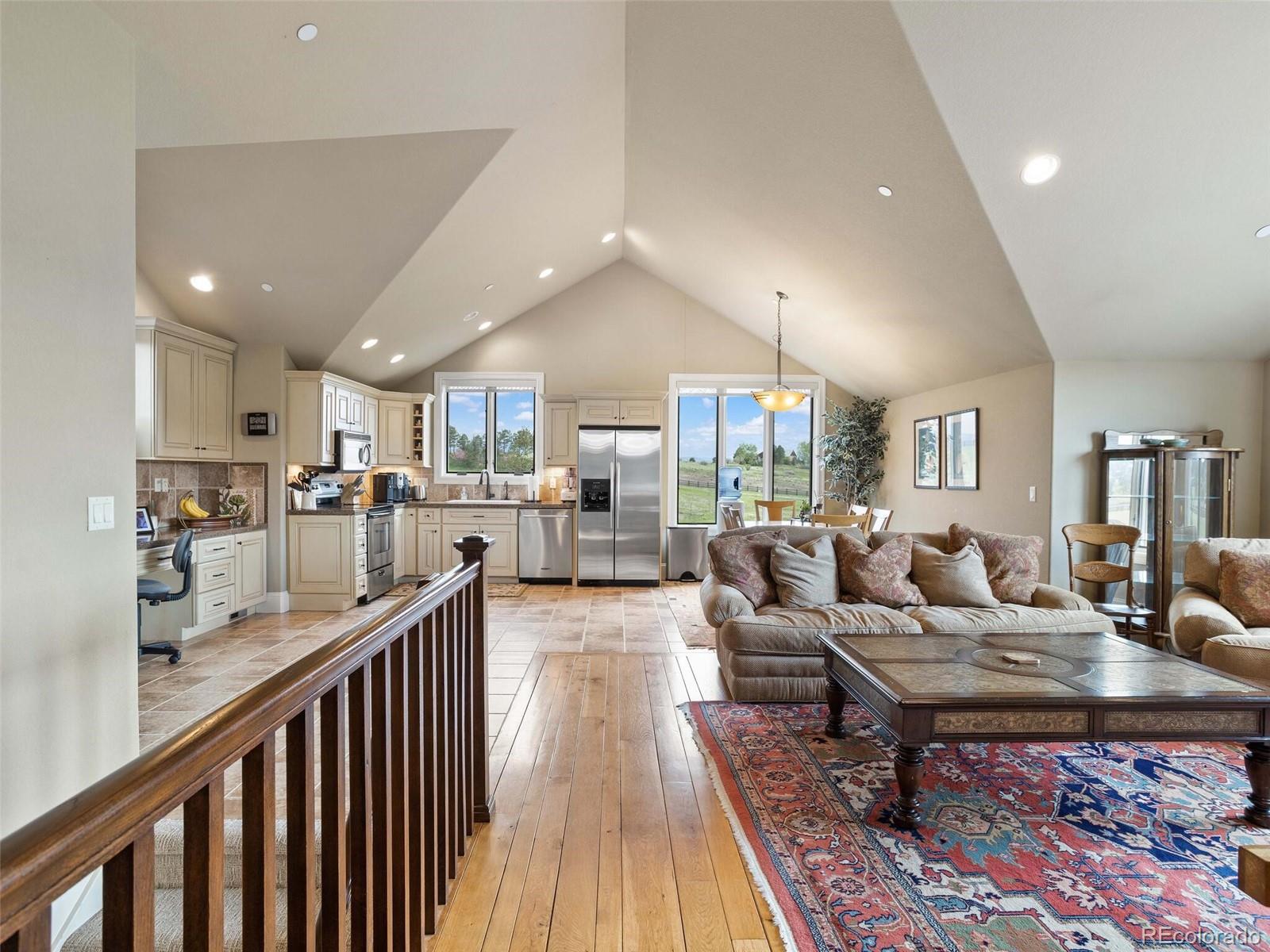 1395 Waverton Ranch Road Castle Rock, CO 80109 - Photo 36 of 40 a living room with lots of furniture and kitchen view