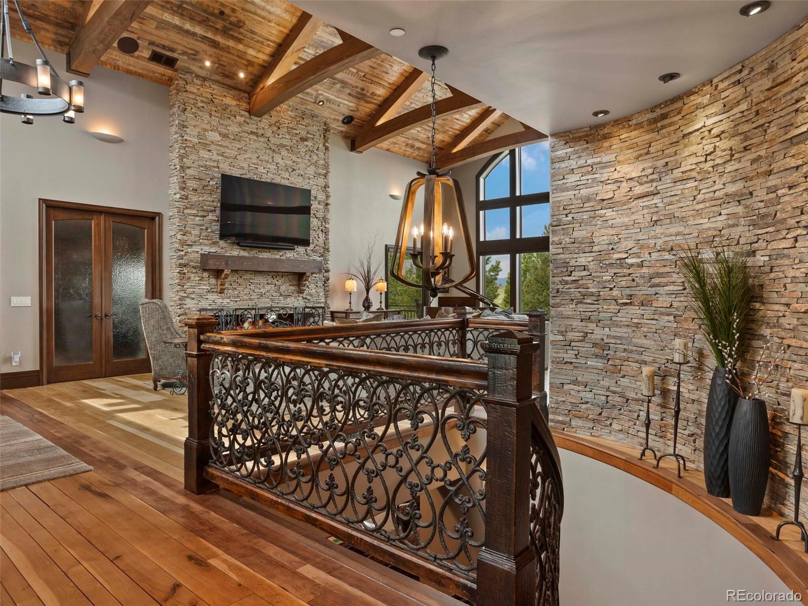 1395 Waverton Ranch Road Castle Rock, CO 80109 - Photo 8 of 40 a view of outdoor space with wooden floor and flat screen tv