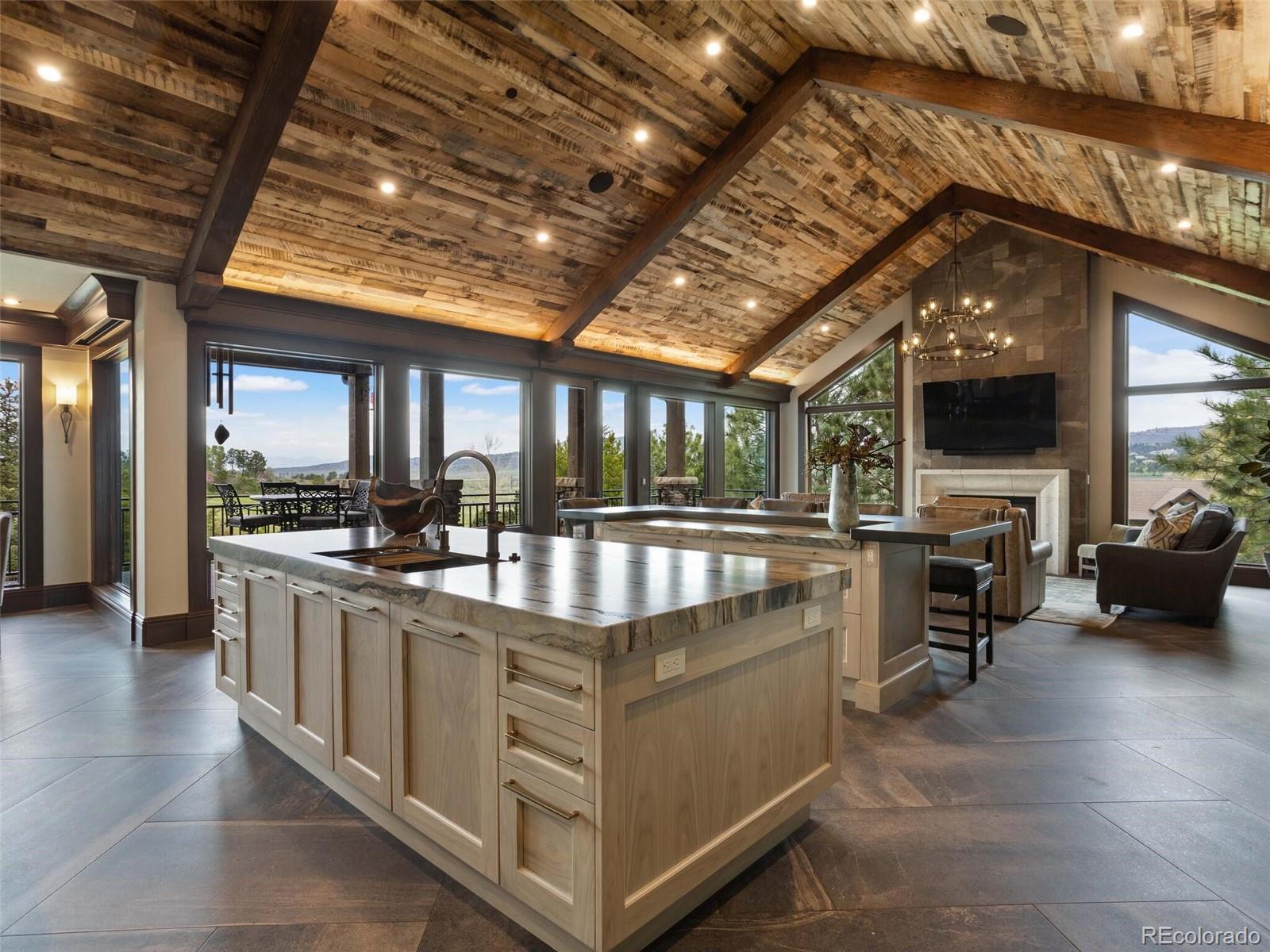 1395 Waverton Ranch Road Castle Rock, CO 80109 - Photo 10 of 40 a view of living room kitchen with stainless steel appliances granite countertop lots of counter top space
