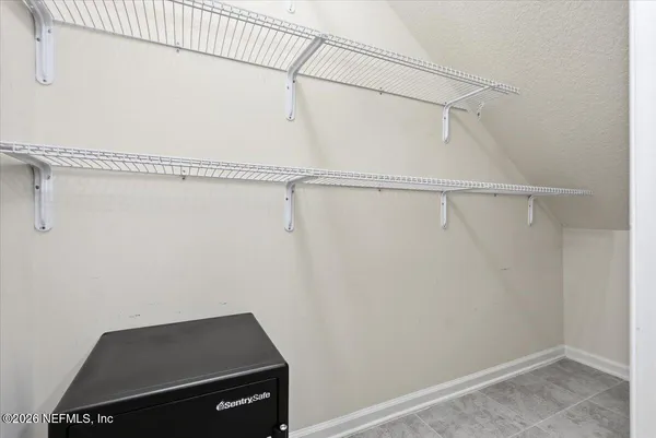 a view of a room with racks on the wall