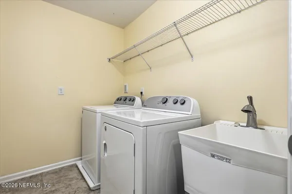 a utility room with dryer and washer