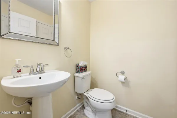 a bathroom with a sink and mirror