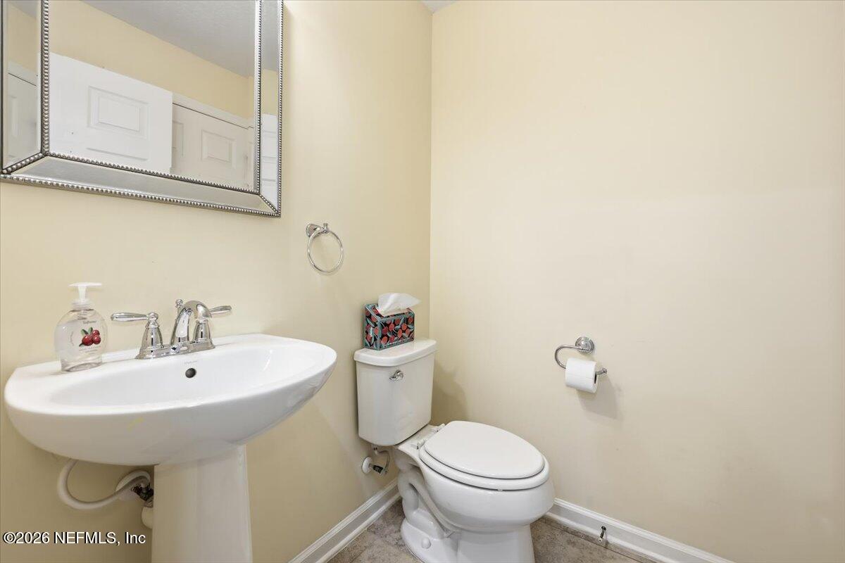 148 Paradas Place St. Augustine, FL 32092 - Photo 19 of 24 a bathroom with a sink and mirror