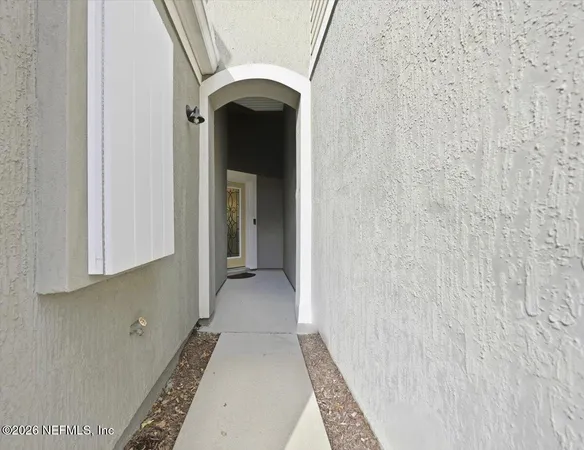 a view of hallway with washer and dryer