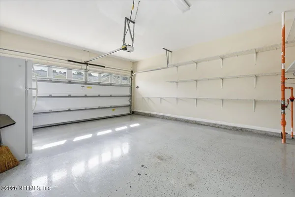 a view of a room with storage and utility room