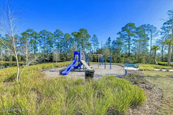 a view of a park with swings and slides