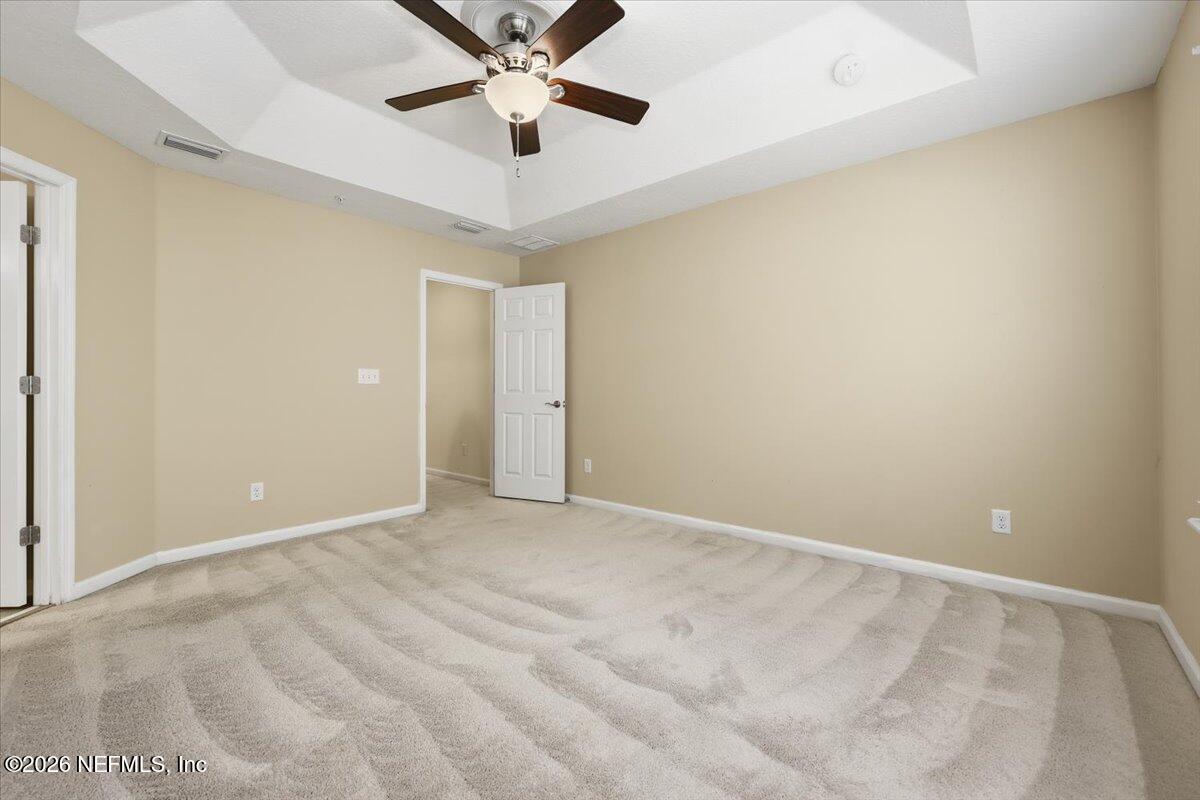 148 Paradas Place St. Augustine, FL 32092 - Photo 9 of 24 an empty room with chandelier fan