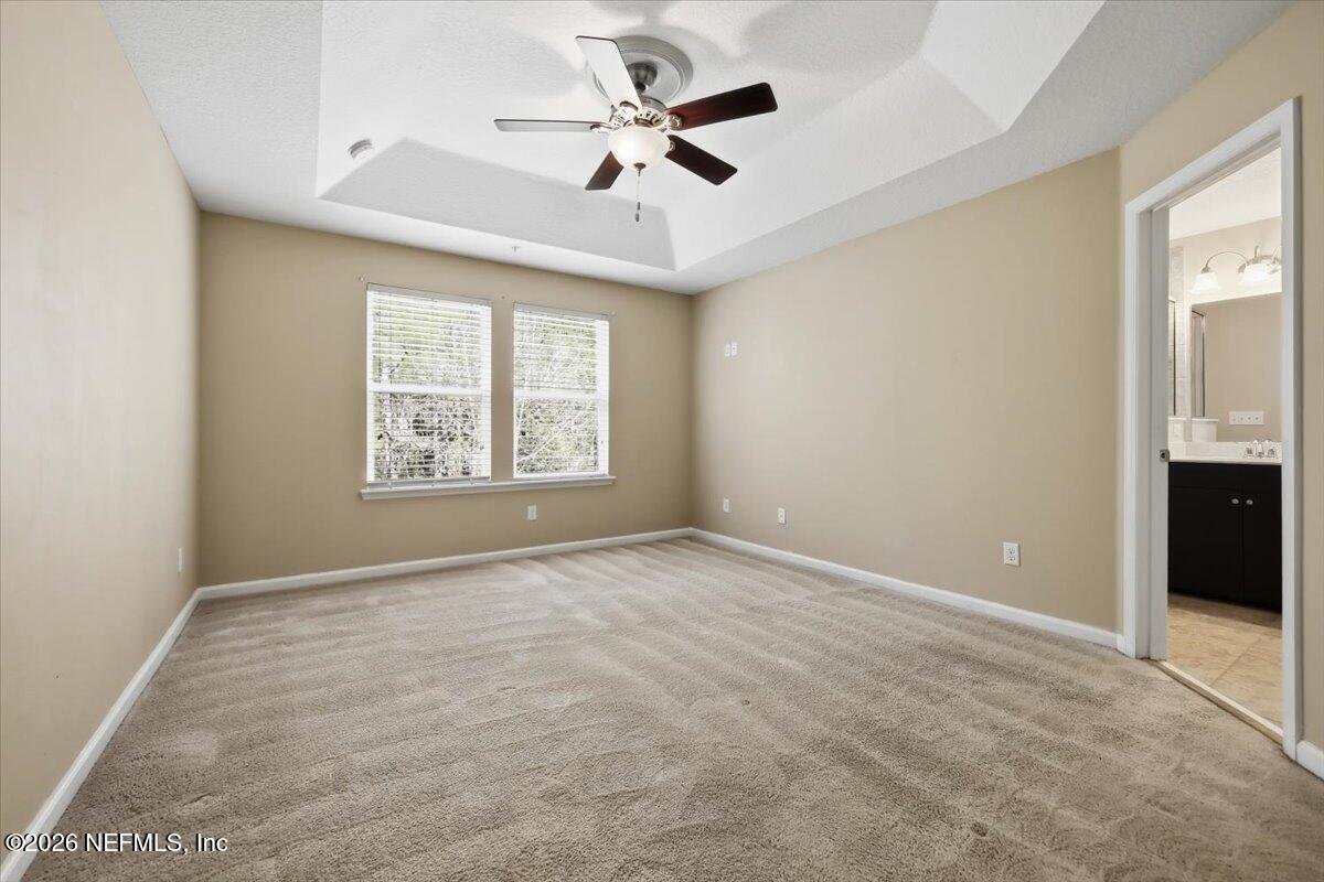 148 Paradas Place St. Augustine, FL 32092 - Photo 10 of 24 an empty room with windows and ceiling fan