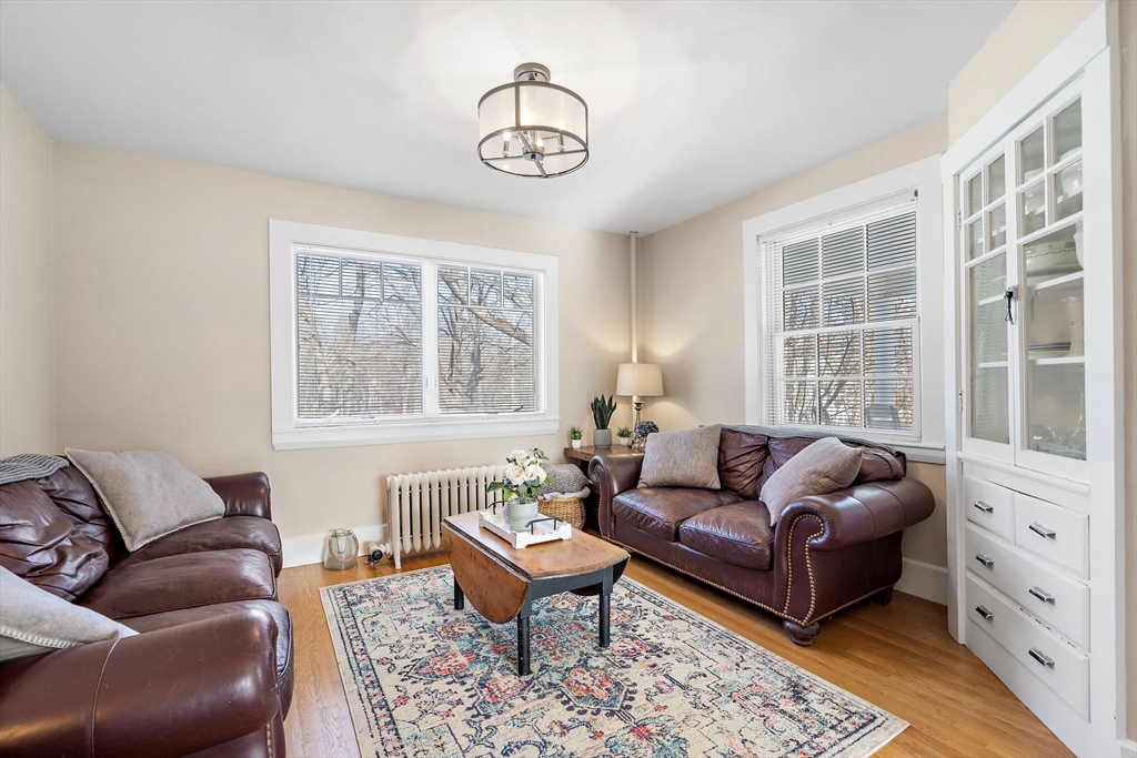1190 Liberty Square Road Boxborough, MA 01719 - Photo 15 of 24 a living room with furniture and a large window