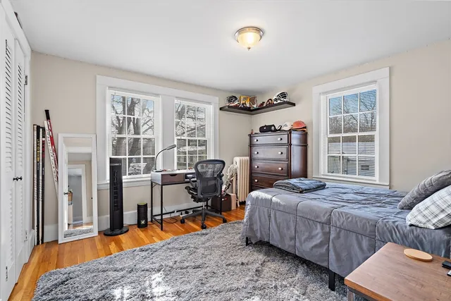 a bedroom with a bed and a tv