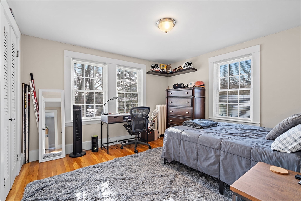 1190 Liberty Square Road Boxborough, MA 01719 - Photo 16 of 24 a bedroom with furniture and a large window