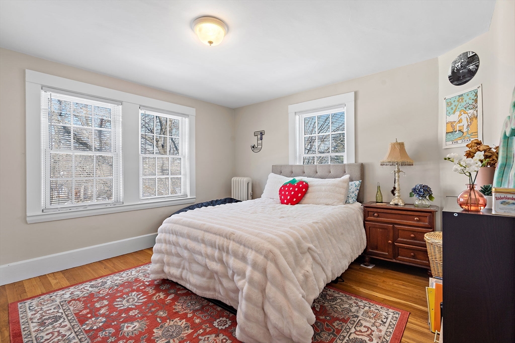 1190 Liberty Square Road Boxborough, MA 01719 - Photo 20 of 24 a bedroom with a bed and a dresser next to a window