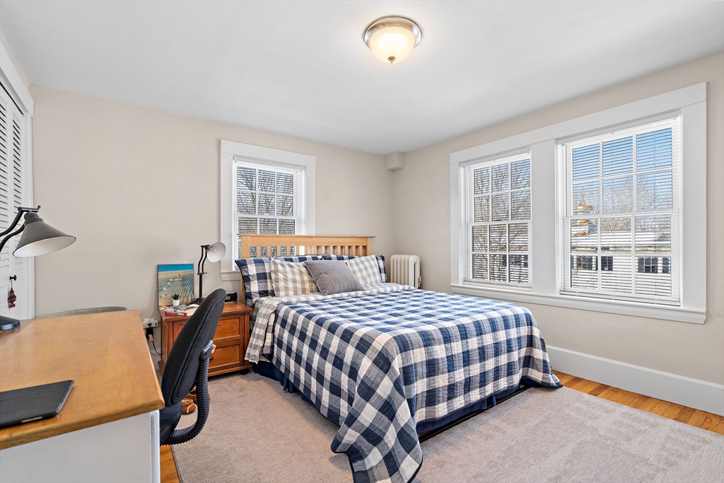 1190 Liberty Square Road Boxborough, MA 01719 - Photo 21 of 24 a bedroom with a bed a table and windows