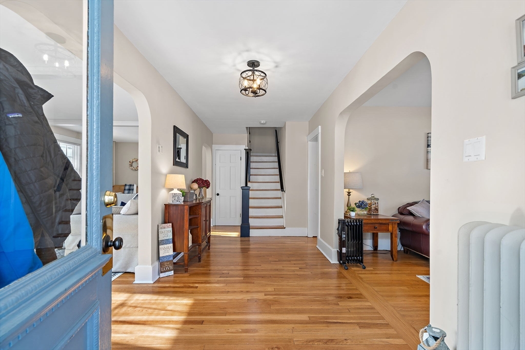 1190 Liberty Square Road Boxborough, MA 01719 - Photo 7 of 24 a view of a livingroom with furniture and a flat screen tv