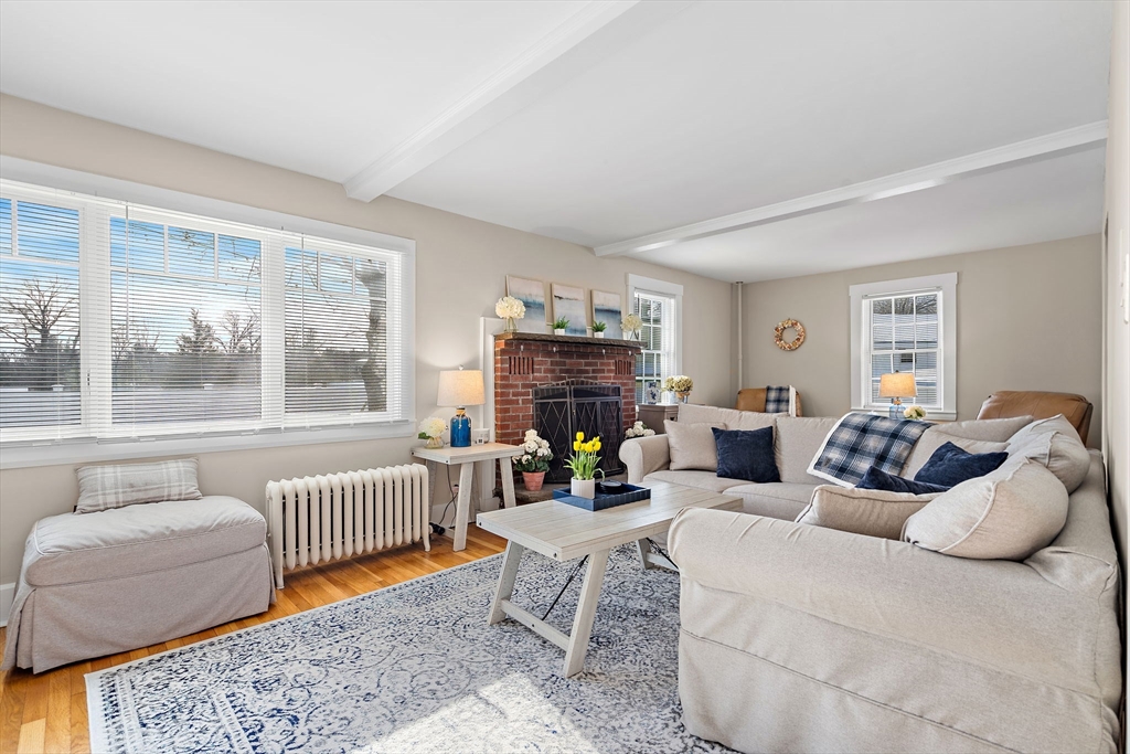 1190 Liberty Square Road Boxborough, MA 01719 - Photo 9 of 24 a living room with furniture and a fireplace