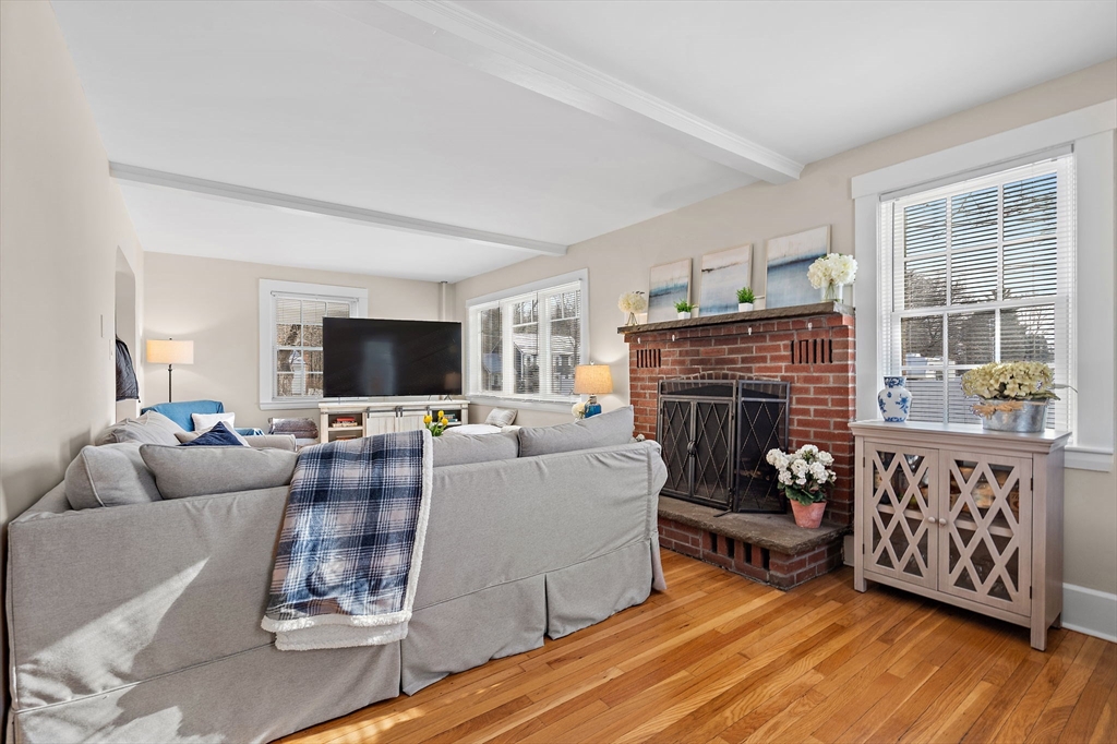 1190 Liberty Square Road Boxborough, MA 01719 - Photo 10 of 24 a living room with furniture a flat screen tv and a fireplace
