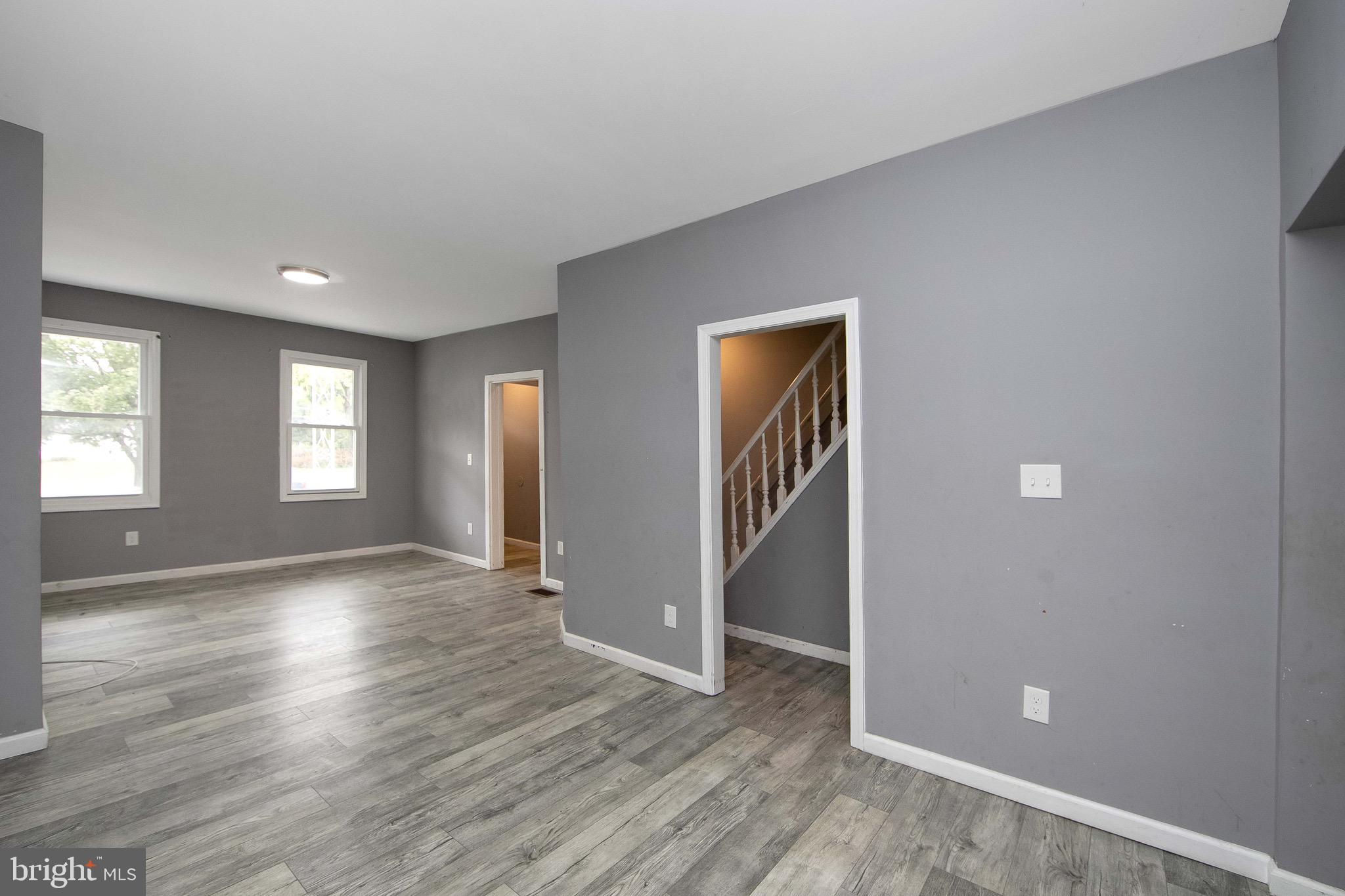 133 East Federal Street Burlington, NJ 08016 - Photo 11 of 43 an empty room with wooden floor and windows