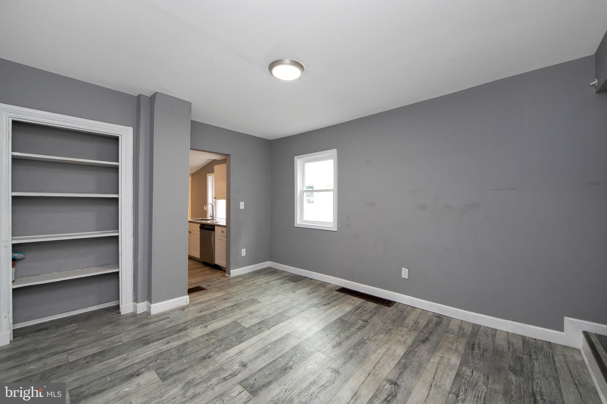 133 East Federal Street Burlington, NJ 08016 - Photo 12 of 43 a view of an empty room with a window and wooden floor