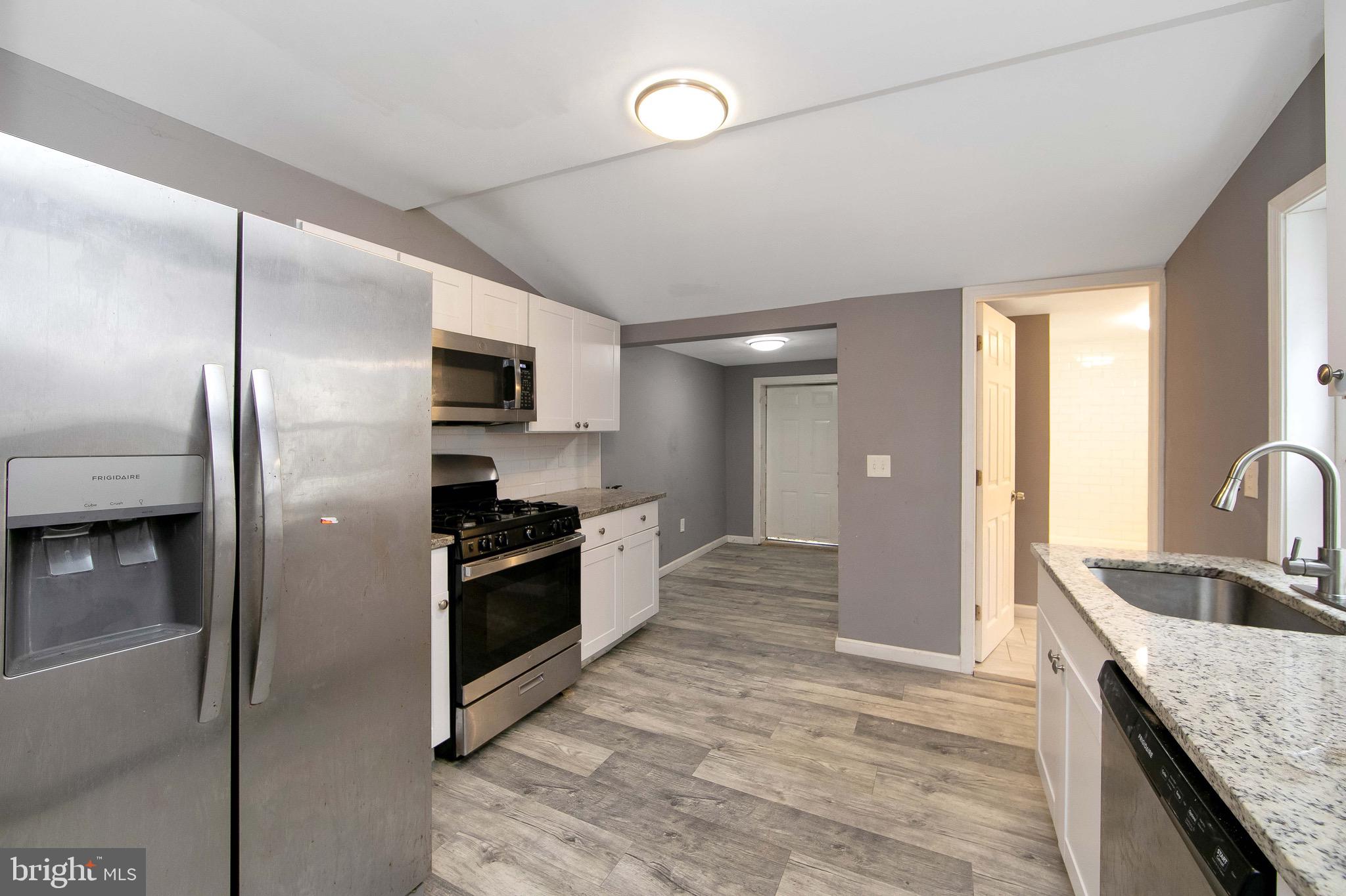 133 East Federal Street Burlington, NJ 08016 - Photo 15 of 43 a kitchen with stainless steel appliances granite countertop a sink and a refrigerator